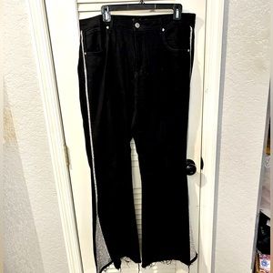 Black bell bottom jeans with rhinestone trim